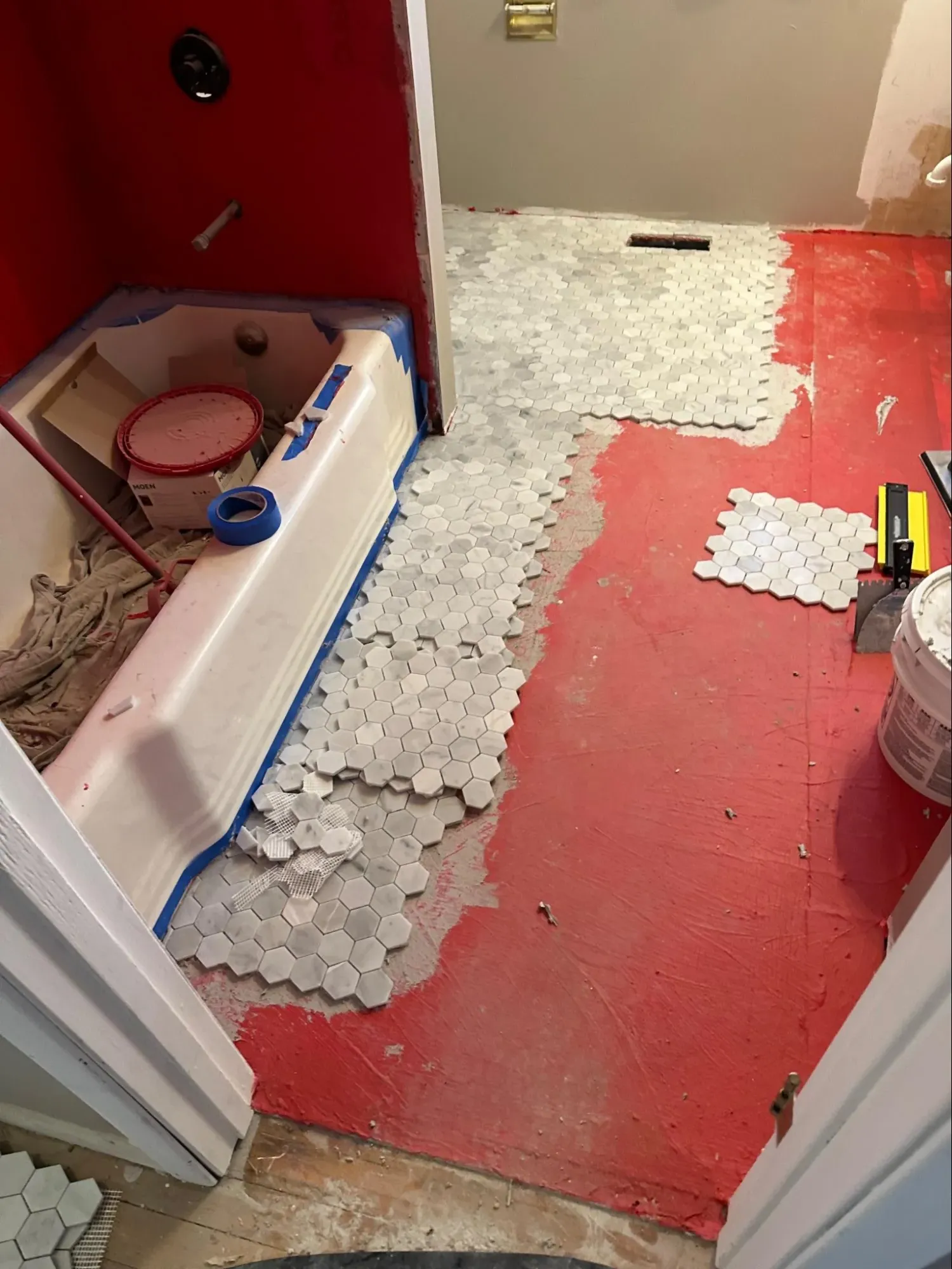 Older bathroom with deteriorated tile work and aged plumbing fixtures requiring renovation