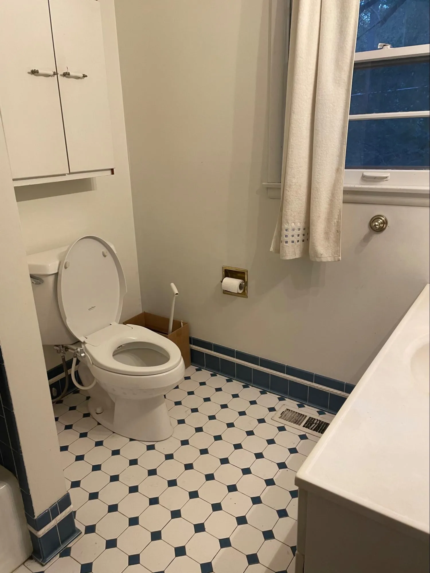 Bathroom before professional remodeling with outdated tile and worn faucet installations