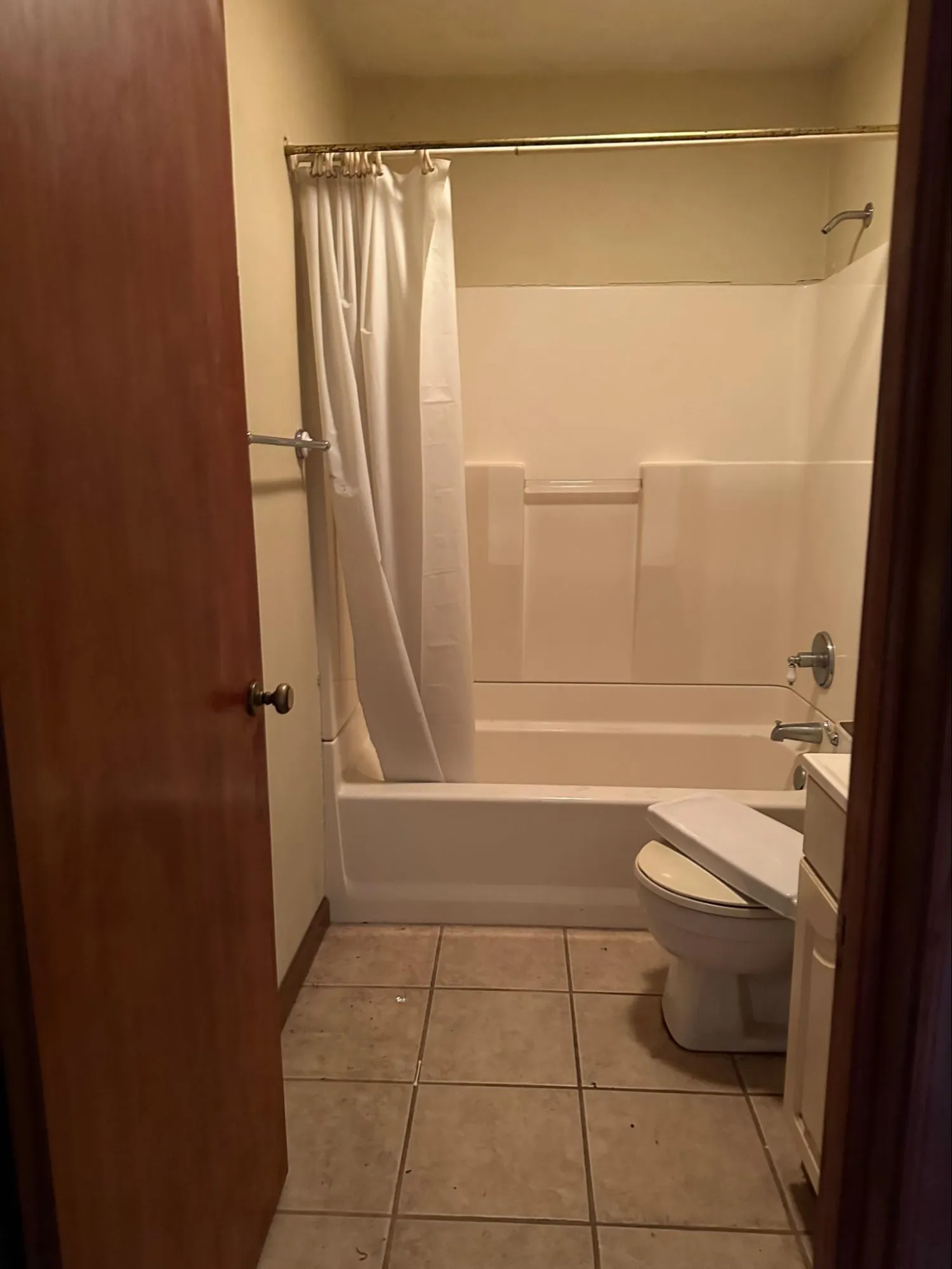 Outdated bathroom with worn cabinet work and dated plumbing requiring property improvement