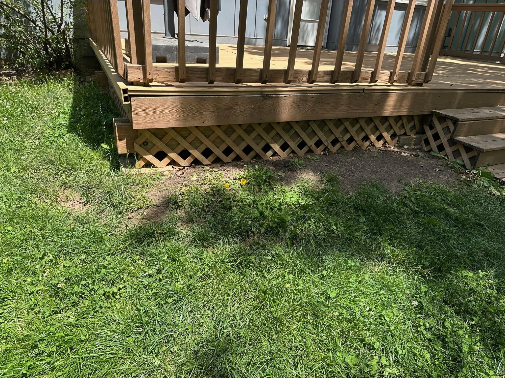 Completed deck installation with fresh wood staining