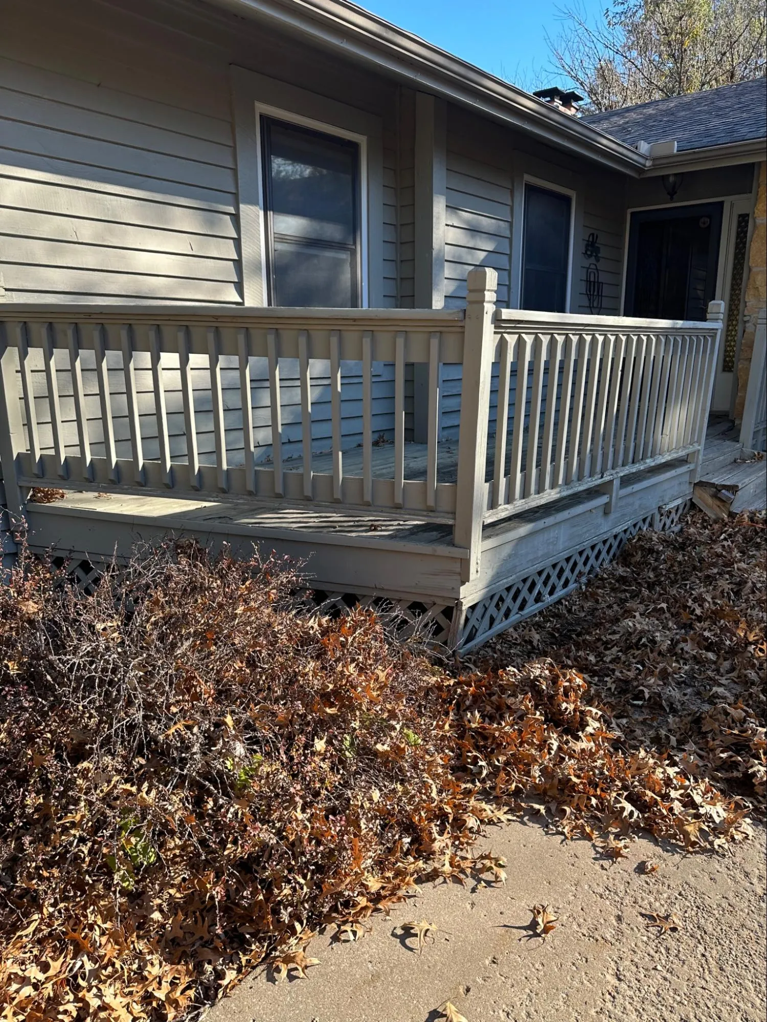 Residential deck before repair showing significant wood rot damage