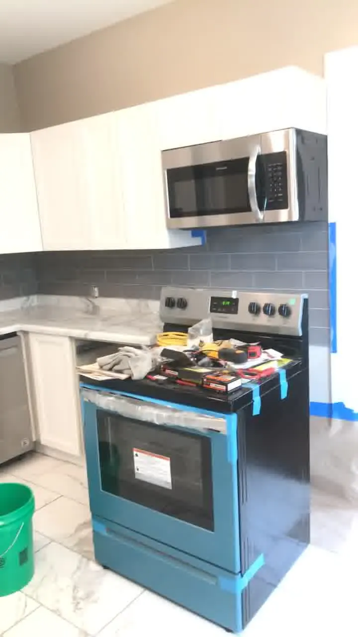 Kitchen before renovation with worn cabinetry, outdated fixtures, and flooring needing kitchen remodeling updates